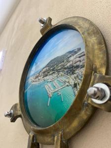 a mirror with a picture of a harbor at A due passi da in Formia