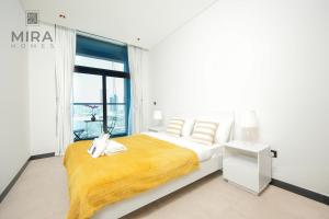 Postel nebo postele na pokoji v ubytování Mira Holiday Homes - Lovely 2 bedroom in Business Bay