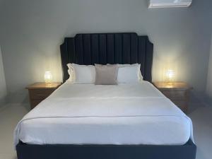 מיטה או מיטות בחדר ב-Gaia Residence Deluxe