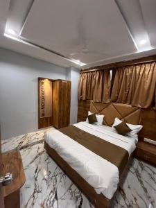Postel nebo postele na pokoji v ubytování HOTEL KRISHNA