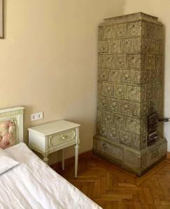 Ένα ή περισσότερα κρεβάτια σε δωμάτιο στο Апартаменти на Театральній