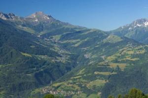 a view of a mountain valley with a town on it at SAVOIE/ petit chalet studio meublé in Aigueblanche +5 photos