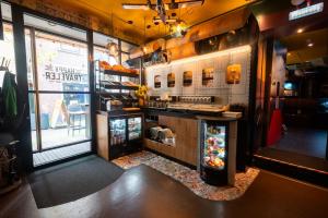 a restaurant kitchen with a counter and a refrigerator at Hotel The Happy Traveler in Groningen