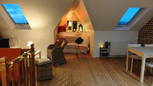 a living room with a bed and a table at VILLA GARGANTUA in Cayeux-sur-Mer