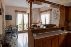a kitchen with a counter with a sink in it at Άγρια Λούλουδα Κατοικία Ευτυχία in Timfristós