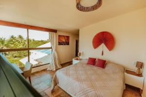Giường trong phòng chung tại Vila Harmonia sua casa na Praia do Preá +53 ảnh
