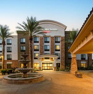 a hotel with a fountain in front of a building at Residence Inn Phoenix Glendale Sports & Entertainment District in Glendale