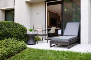 a patio with two chairs and a table at Bethesda Marriott in Bethesda