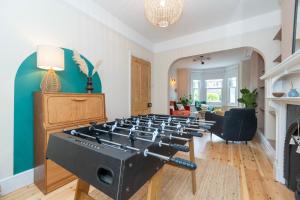 a living room with a row of gas burners at Chic Townhouse in the heart of Historical Exeter 5mins to Centre in Exeter