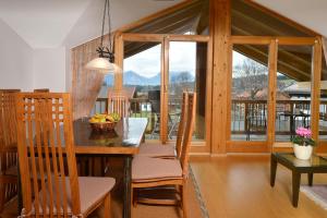 a dining room with a table and chairs at Residenz Sonnwinkl in Reit im Winkl