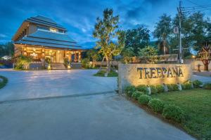 a home with a treearma sign in front of a building at Treepana Boutique Hotel, Huahin in Hua Hin