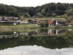 a town with houses and a body of water at Obere-Seeterrasse in Rieden
