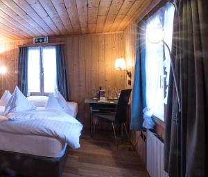 Voodi või voodid majutusasutuse Hotel Kemmeriboden-Bad AG toas