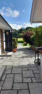 a stone walkway in front of a house at The Studio in Klövedal