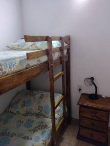 a bedroom with two bunk beds and a desk at Departamento "Juana"para 4 personas 2 cuartos con garage en Santa Teresita in Santa Teresita +2 photos