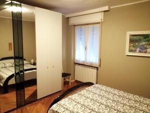 Postel nebo postele na pokoji v ubytování Appartamento Casa Corrada