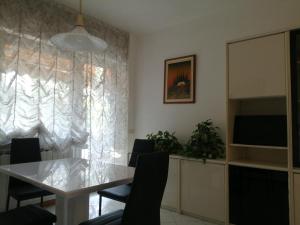 TV a/nebo společenská místnost v ubytování Appartamento Casa Corrada