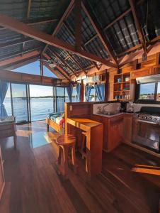 a kitchen with a table and a counter top at Barrbra BnB Over The Sea in Bocas Town