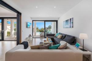 a living room with a couch and a table at Nereo in Alcudia