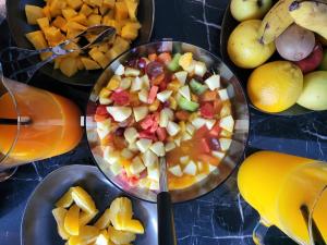 a table topped with a bowl of food with fruit at Puro Dão Hotel & Spa in Nelas