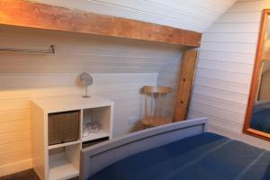 a tiny house with a fireplace in a room at The Scullery - a quirky annex with wood fire in Huddersfield
