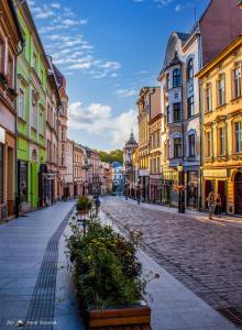 a cobblestone street in a city with buildings at Apartament Sejmowa in Cieszyn