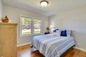 a bedroom with a bed and a window at Greenville Vacation Rental - 3 Mi to Downtown! in Greenville