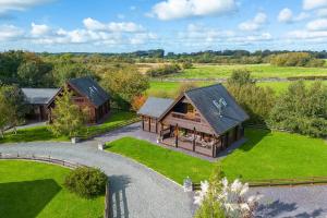 an aerial view of a home with a barn at Scandi Cabin in Heart of Anglesey with Parking in Llanfairpwllgwyngyll