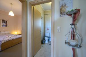 Postel nebo postele na pokoji v ubytování Pavlina's Apartments 1