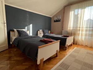 Postel nebo postele na pokoji v ubytování Apartman Stojanović