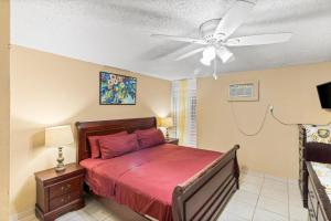 a bedroom with a bed and a ceiling fan at Not only you have a view condo in Christiansted