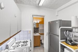 a kitchen with a stove and a refrigerator at One Nice Caribbean View condo in Christiansted