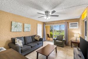 a living room with a couch and a ceiling fan at A getaway to a getaway condo in Christiansted