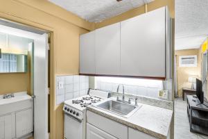 a kitchen with a sink and a stove at A getaway to a getaway condo in Christiansted