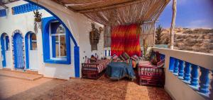 a room with chairs and a table in a building at The Sunrise Villa in Agadir