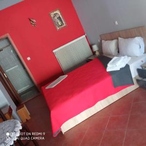 Postel nebo postele na pokoji v ubytování Guest House Sakis.