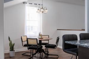 a dining room with a table and chairs at Flexhome Logan Square Duplex 3BR Apt S2 - READ INFO in Chicago