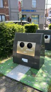 a sculpture of a toaster sitting on the grass at Okapi in Halle