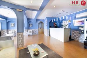 a lobby of a hotel with blue walls at Urban Hotel Santa Eulalia in Albufeira