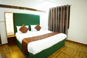 Postel nebo postele na pokoji v ubytování RICHBERRY- A Premium Plantation Villa's