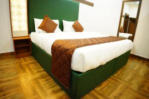 Postel nebo postele na pokoji v ubytování RICHBERRY- A Premium Plantation Villa's