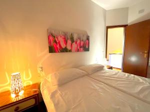 A bed or beds in a room at Residence Paguro