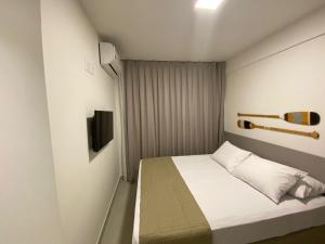 Postel nebo postele na pokoji v ubytování Edifício Promenade II Apt 403 -Mandi Hospitalidade + 28 fotografií