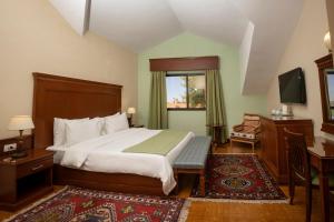 Postel nebo postele na pokoji v ubytování Le Cedrus Hotel