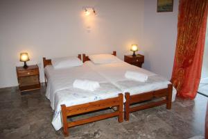 
Ένα ή περισσότερα κρεβάτια σε δωμάτιο στο Olympion Village Studios
