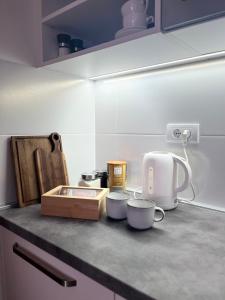 a kitchen counter with various appliances on it at Jahorina Apartment4Two in Jahorina