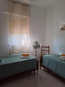 Posteľ alebo postele v izbe v ubytovaní La Casa Di Donato E Maria