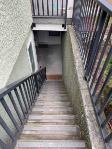 a staircase leading up to a building with a balcony at Entire Guest Suite - 1 bedroom w/ Private Entrance in Surrey