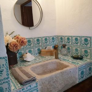 a bathroom counter with a sink and a mirror at Finca Altozano - Private pool - Unique client in Valle de Abdalagís