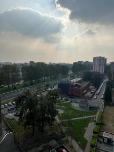 a view of a parking lot in a city with cars at Appartamento a Milano, 12 minuti dalla stazione centrale FS in Cinisello Balsamo